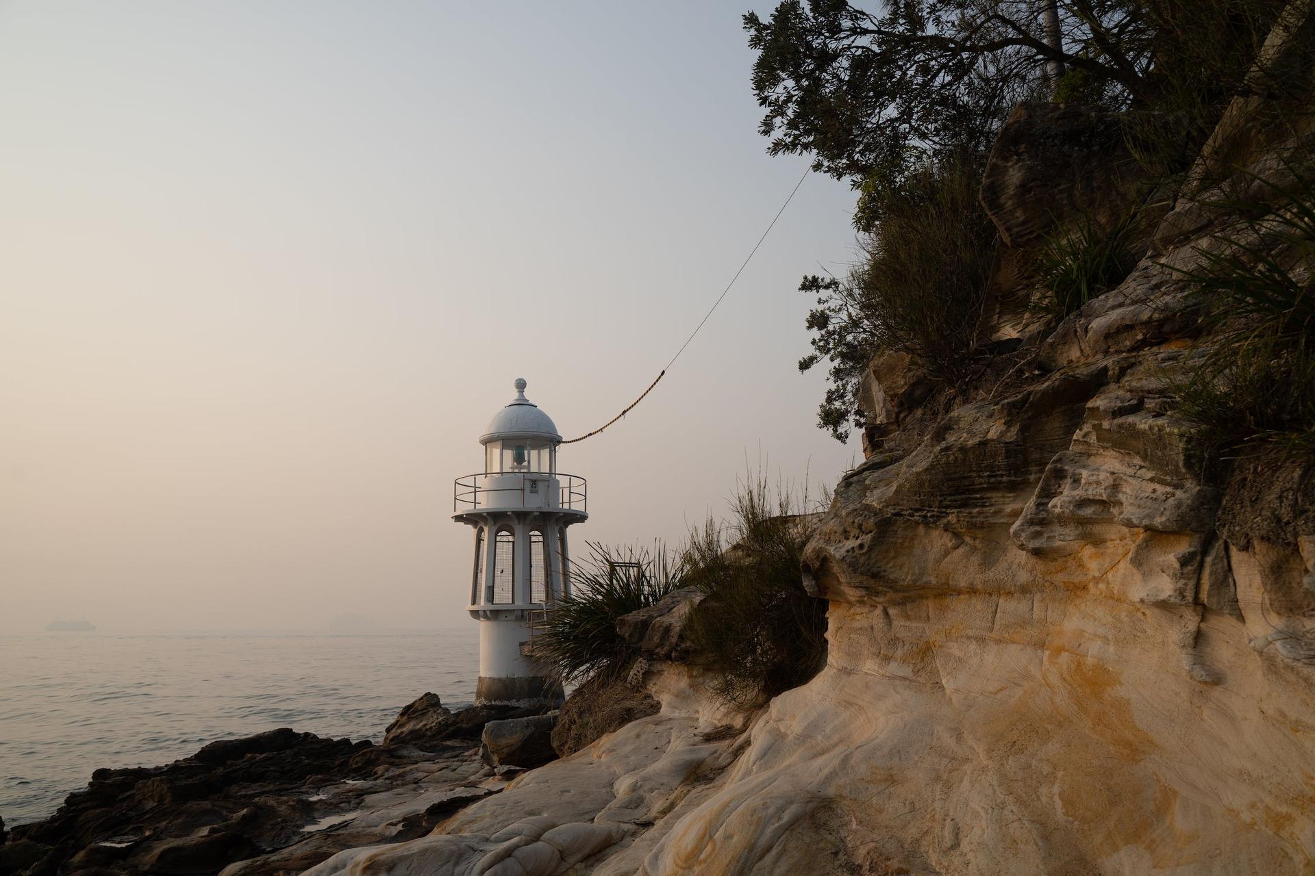 A lighthouse on a tiny island.